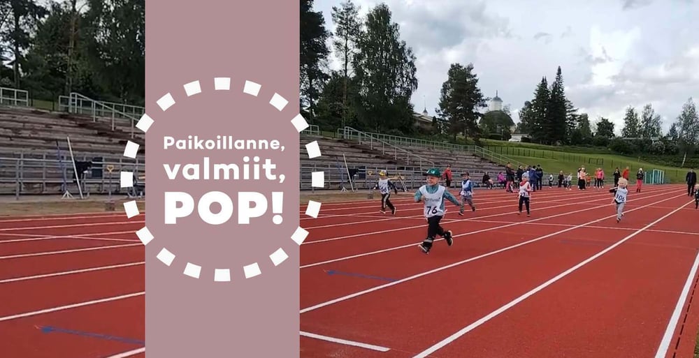 Kuva juoksuradasta, jossa juoksee lapsia. Kuvassa kuvake, jossa tekstinä valmiina, paikoillanne, POP!